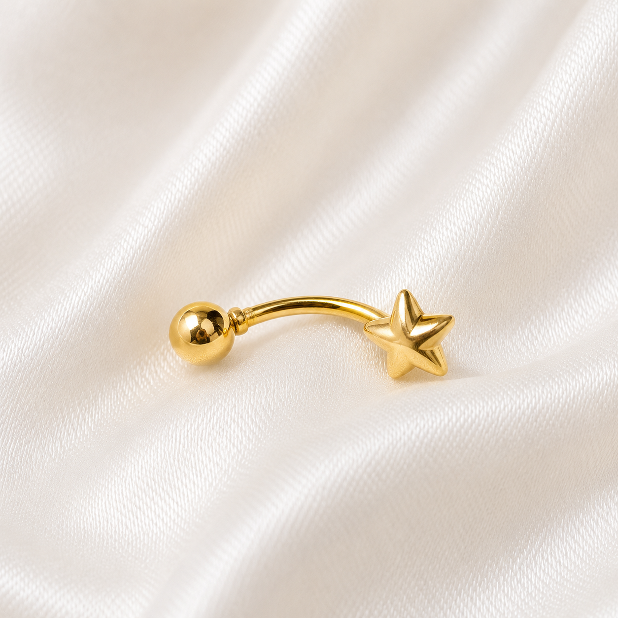 PIERCING DE UMBIGO COM FORMATO DE ESTRELA