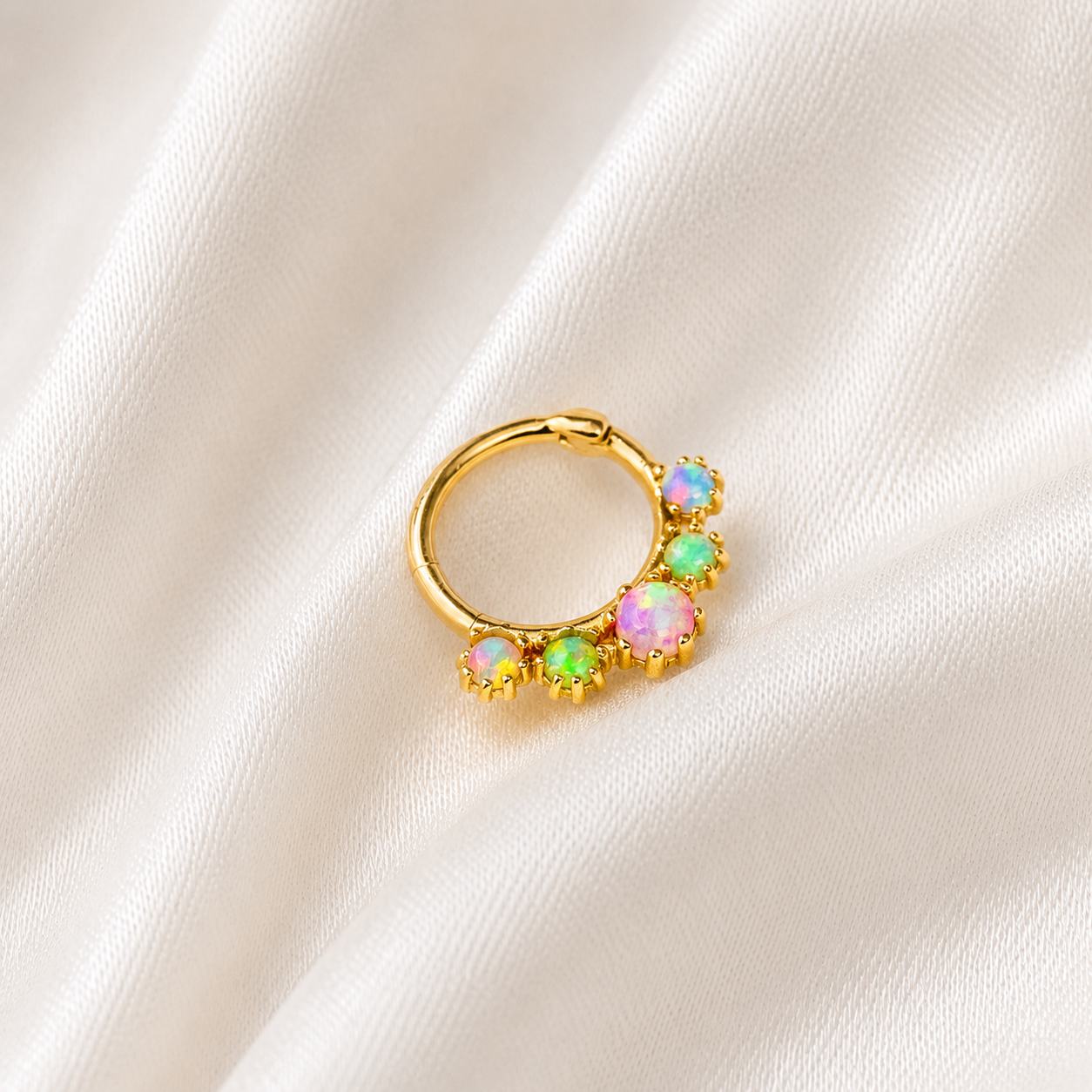 PIERCING COM PEDRAS COLORIDAS